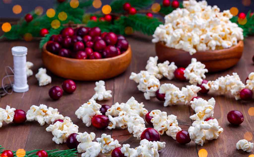 Making popcorn garland is a great Christmas activity to enjoy during the holiday season